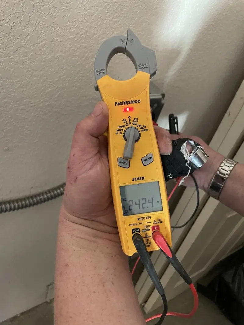 Voltage testing with clamp meter during Generator Installation in Belle Glade